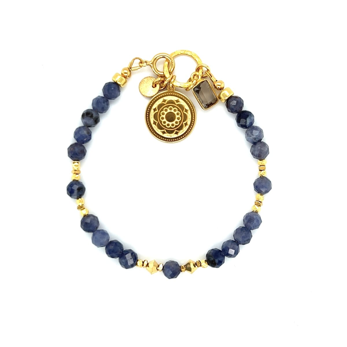 Bransoletka Tanzanit Bogini Wyzwolenia od Ewa Mrochen Jewellery z kamieniami tanzanit na eleganckiej ręce.