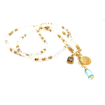 Naszyjnik Topaz Błękitny od Ewa Mrochen Jewellery, ozdobny z błękitnym topazem na delikatnym łańcuszku.